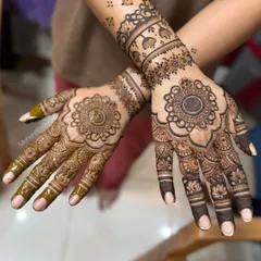 Another view of the engagement mandala design, showing the difference in stain color as the henna paste dries.