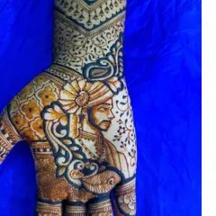 Here is the groom's portrait from the same bridal set. The design includes his turban and traditional attire, perfectly complementing the bride's henna.