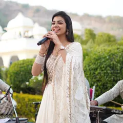 A candid shot of me smiling while performing with my band in the background. Their music is the backbone of every performance, and their energy is infectious.