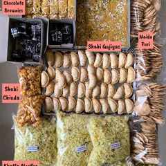 A beautiful festive spread for Raksha Bandhan, featuring a mix of my traditional sweets and modern baked goods. This shows the variety I offer, including Shahi Gujiyas, Mohanthal, Double Chocolate Brownies, and savory chivda.