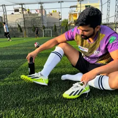 Taking a break on the football field. Playing a sport is one of my favorite ways to stay active and have fun.