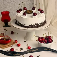 A classic Black Forest Gateau, done the right way. It features layers of rich chocolate sponge, fresh whipped cream, and juicy cherries.