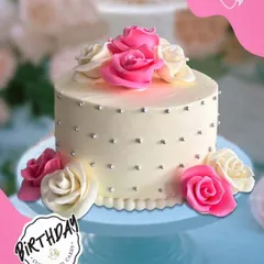Minimalist, elegant, and full of grace. This simple yet stunning cake for Trisha's birthday in Lajpat Nagar features perfectly crafted sugar roses and tiny pearl details on a smooth white canvas.