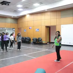 Setting up for a corporate fitness workshop. I make sure every session is well-prepared, creating a welcoming space where employees can step away from their desks and into a zone of positive energy.