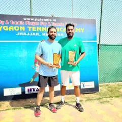 Another shot from our successful run at the ITF MT-400 in Jhajjar. My brother Kartikeya and I celebrate our doubles victory, a result of teamwork and our shared "until the last ball" philosophy.