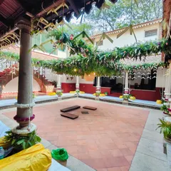 Another view of the traditional wedding decor, showing the seating arrangement with mattresses and bolsters on the terracotta floor, ready for the guests.