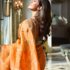 A beautiful profile of Nimrat Kaur. The makeup was designed to look radiant and natural, enhancing her classic beauty.
