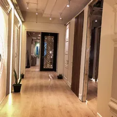 A look down the corridor of my Ghitorni showroom, where clients can explore a wide variety of door designs and finishes in a real-world setting.