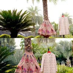 A creative shot of the bride and groom's wedding outfits hanging from a palm tree, showcasing them in a unique and artistic way.