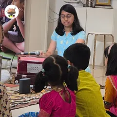 A group of children listening with rapt attention during a Raag Sangeet session. We believe in creating an environment where even the youngest listeners can appreciate the depth and beauty of classical music.