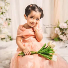 Creating memories stitched with love. This enchanting mother-daughter duo, Meghana and her little one, are twinning in elegant peach organza gowns I designed for their special Mother's Day photoshoot.