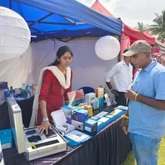 A member of our team provides a hands-on demonstration of our smart home products to an interested visitor. We believe in letting customers experience the convenience firsthand.