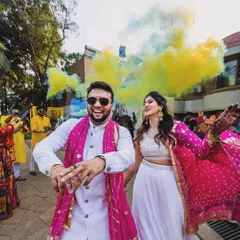 A vibrant and colorful entry with smoke bombs. We plan high-energy couple entries that get everyone excited for the celebration ahead.