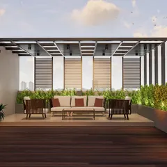 This rooftop terrace in Mangaluru is an urban oasis we designed to blend architecture with nature. A sleek metal pergola provides structure and shade, while the vertical garden wall and rich wooden decking create a lush, biophilic escape from the city below.