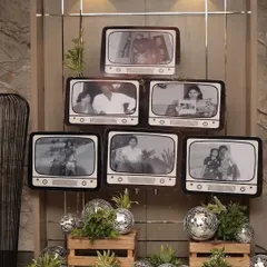 A creative way to honor history. For this 60th birthday, I designed a photo wall using retro TV frames to display cherished memories. This concept is perfect for showcasing a company's journey at an anniversary celebration.
