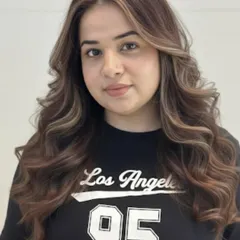 An iconic brown balayage. The highlights are perfectly placed to create dimension and movement, resulting in a truly artistic and beautiful hair color.