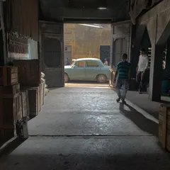 A simple shot of a car outside a doorway, made cinematic through careful lighting. We created a strong, hard backlight to simulate bright exterior sunlight, which contrasts with the softer, ambient light filling the foreground interior space.