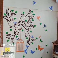 Another look at the multi-colored nature stencil, showing how the birds and butterflies appear to be flying off the branch. This design adds movement and joy to the wall.
