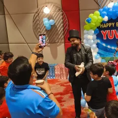 A magical moment captured. A magician performs a classic dove trick, delighting children and adults alike at a birthday party we organized. Live entertainment is a fantastic way to elevate any event.