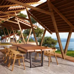A residential project in Lonavala, featuring a covered outdoor dining area with an expansive view of Pavna Lake. The design utilizes a diagrid roof structure and natural wood to create a seamless connection between the built environment and the surrounding landscape.