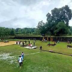 Exploring the historic Nagara Fort, with its green lawns and ancient walls. This is one of the many sights included in our Kodachadri trip.