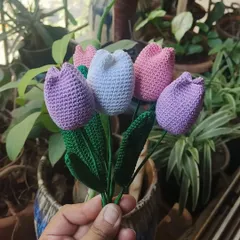 A lovely bunch of our handmade crochet tulips in shades of lavender, white, and pink. Each petal and leaf is carefully stitched to create a realistic and charming floral piece.