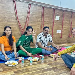 Enjoying a community meal (bhandara) together. Sharing food and conversation is how we strengthen the bonds of our Kula.