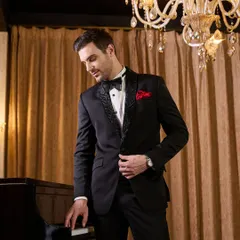 A closer look at the details of my black tuxedo. The lapel features a subtle, elegant pattern that catches the light, adding a layer of texture and sophistication to the classic silhouette. It's these small touches that define true bespoke tailoring.