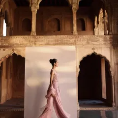 This shot captures the movement and flow of a modern sharara set against a historic, architectural backdrop. The contrast between the contemporary outfit and the setting was a key part of the campaign's visual story.