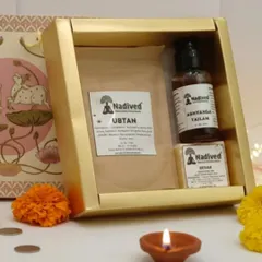 The contents of the Abhyanga Snan gift box, showing the Ubtan pack, Abhyanga Tailam bottle, and Kesar soap bar. Each item is handcrafted for purity and effectiveness.
