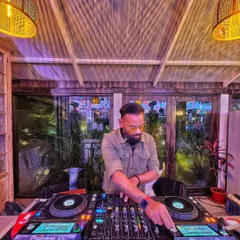 Every night I dream of making you dance to my music. A quiet moment at the decks before the crowd arrives and the night begins.