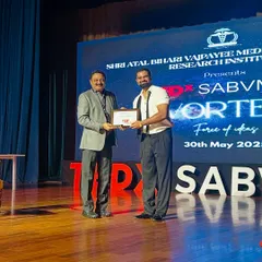 Receiving a token of appreciation after my performance at the TEDx event. I am always grateful for the opportunity to connect with new audiences and the organizers who make these events possible.