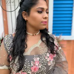A soft and romantic look for a pre-wedding shoot. I used shades of pink on her eyes and lips to complement the floral embroidery on her grey saree, keeping the look fresh and pretty.