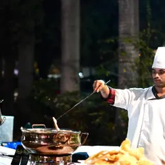 Our chefs are the stars of the show, even at smaller parties. This image captures our chef at a live counter during a birthday celebration, adding a touch of culinary theater to the event.