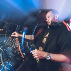 In the zone, mixing tracks and reading the room. This shot captures me doing what I love, blending beats to keep the party going, whether it's a high-energy tech house set or a retro pop night.
