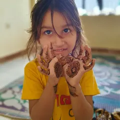 The smile on a child's face is priceless. My daughter asked me to apply mehndi on her hands, and I was more than happy to create this cute little design for her.