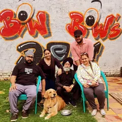 A beautiful family portrait by our graffiti wall after a fun pool session with their golden retriever, Junior.
