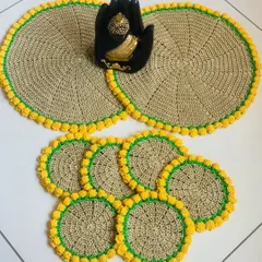 Here is a complete set of fawn-colored placemats and matching coasters, all finished with a bright yellow tulip border. This set makes a wonderful housewarming gift.