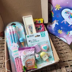 A look inside one of my custom kids' hampers. This one was created as a return gift and includes a pencil set, cute ice cream-themed erasers, biscuits, and other small treats.