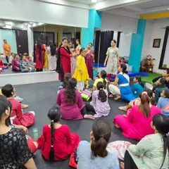 A wide shot of the makeup workshop, showing the engaged and curious faces of our students. We believe in a 360-degree approach to dance education.