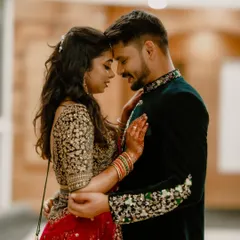 A tender moment between the couple, their foreheads touching in a gesture of closeness and affection. This kind of intimate portrait captures the deep bond they share, away from the chaos of the wedding day.