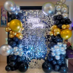 Another angle of the silver shimmer wall and balloon arrangement, showing how it creates a fantastic photo booth for guests.