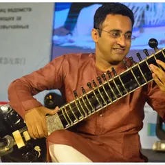A candid moment of joy while performing a traditional piece at a G20 summit event. I am experienced in setting the right tone for formal and prestigious gatherings.