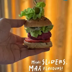 Mini sliders, maximum flavor. This image perfectly captures the handcrafted nature of each slider, showing how much deliciousness I can pack into one small, perfect bite. They are a star appetizer for any grazing table.