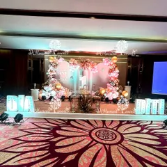 The full stage for the Boho-themed twins' birthday, with large marquee letters spelling out their names, "Dia" and "Diti".