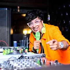 Engaging with the crowd is key to a great night. Here I am on the mic at The Boozy Griffin, interacting directly with the partygoers to keep the energy high and the dance floor moving.
