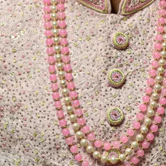 Another detailed shot of the intricate craftsmanship on this premium pink sherwani.