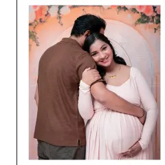 The connection between partners during this time is so special. This is a tender, quiet moment of anticipation and love, captured against a soft, dreamy floral archway. It’s these unscripted embraces that often make for the most cherished pregnancy portraits.