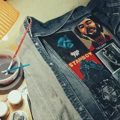A behind-the-scenes shot of The Weeknd jacket in progress. Here you can see my workspace with my paints and brushes, right in the middle of bringing the album art to life.
