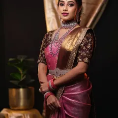 This modern reception look showcases a stylish drape on a pink and brown silk saree, paired with contemporary diamond jewellery. I can adapt my draping style to match the vibe of your event and outfit perfectly.